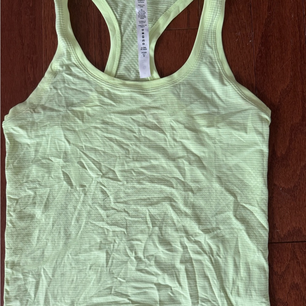 Gently worn women’s Lululemon Athletica neon Yellow Swiftly Tech Tank Top size 4